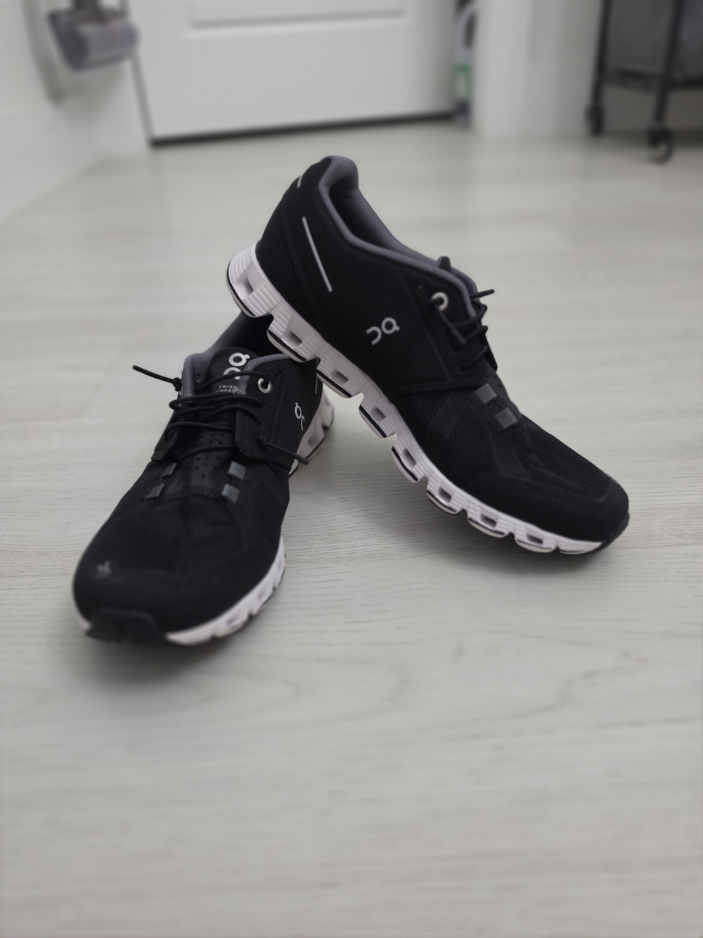 On Cloud Women’s Black Sneakers with White Sole
